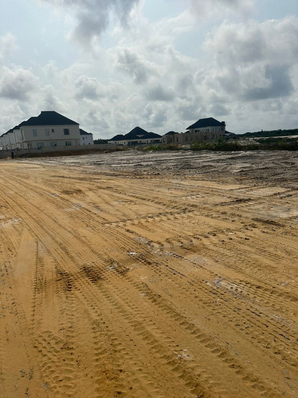 A wider view of the sand-filled site
